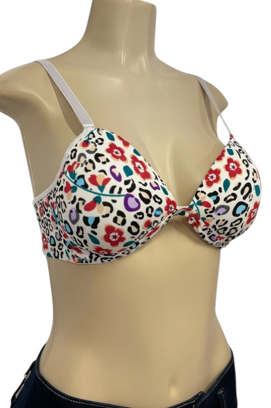 Multicolored floral and leopard print bra on a mannequin with a white background