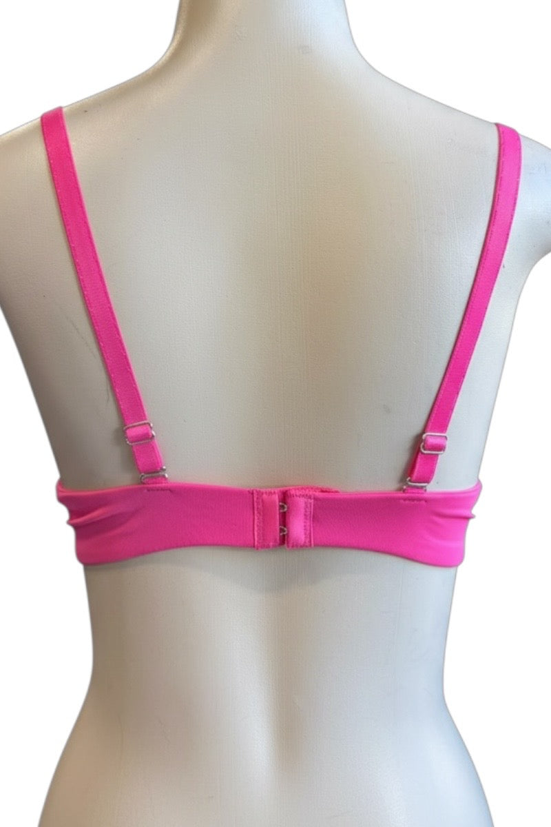 Pink bra on a mannequin with a white background