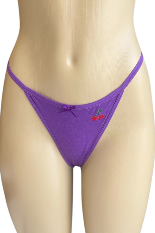 Purple thong with a cherry design on a mannequin against a white background