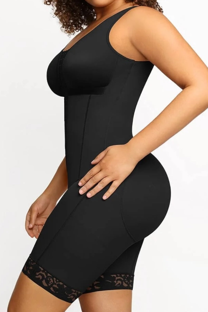 Black shapewear garment worn by a model on a white background