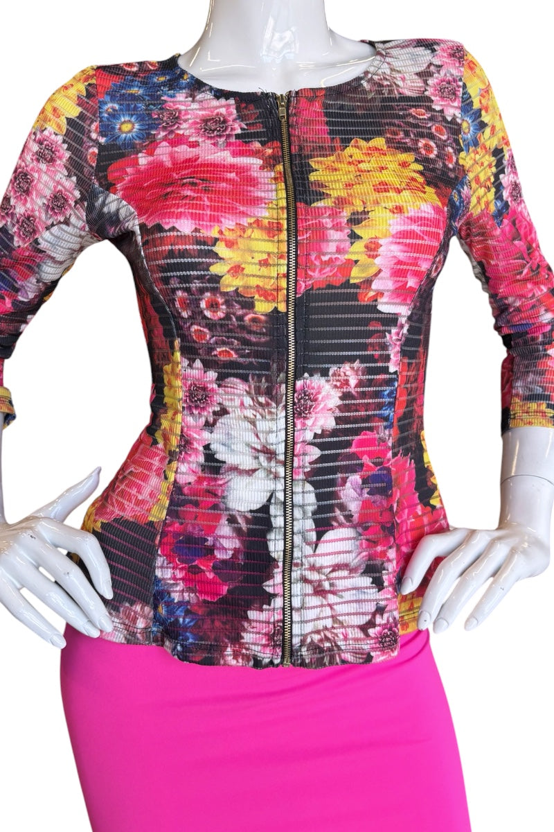 Mannequin wearing a colorful floral-patterned top with a zipper.