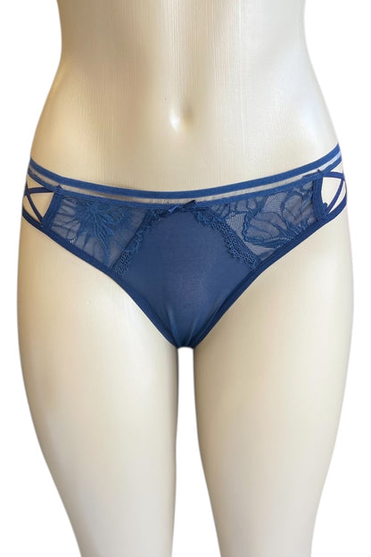 Blue lace underwear on a mannequin against a white background