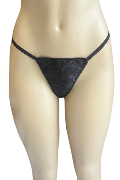Black thong on a mannequin against a white background