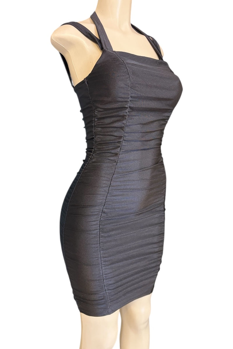 Black dress on a mannequin against a white background