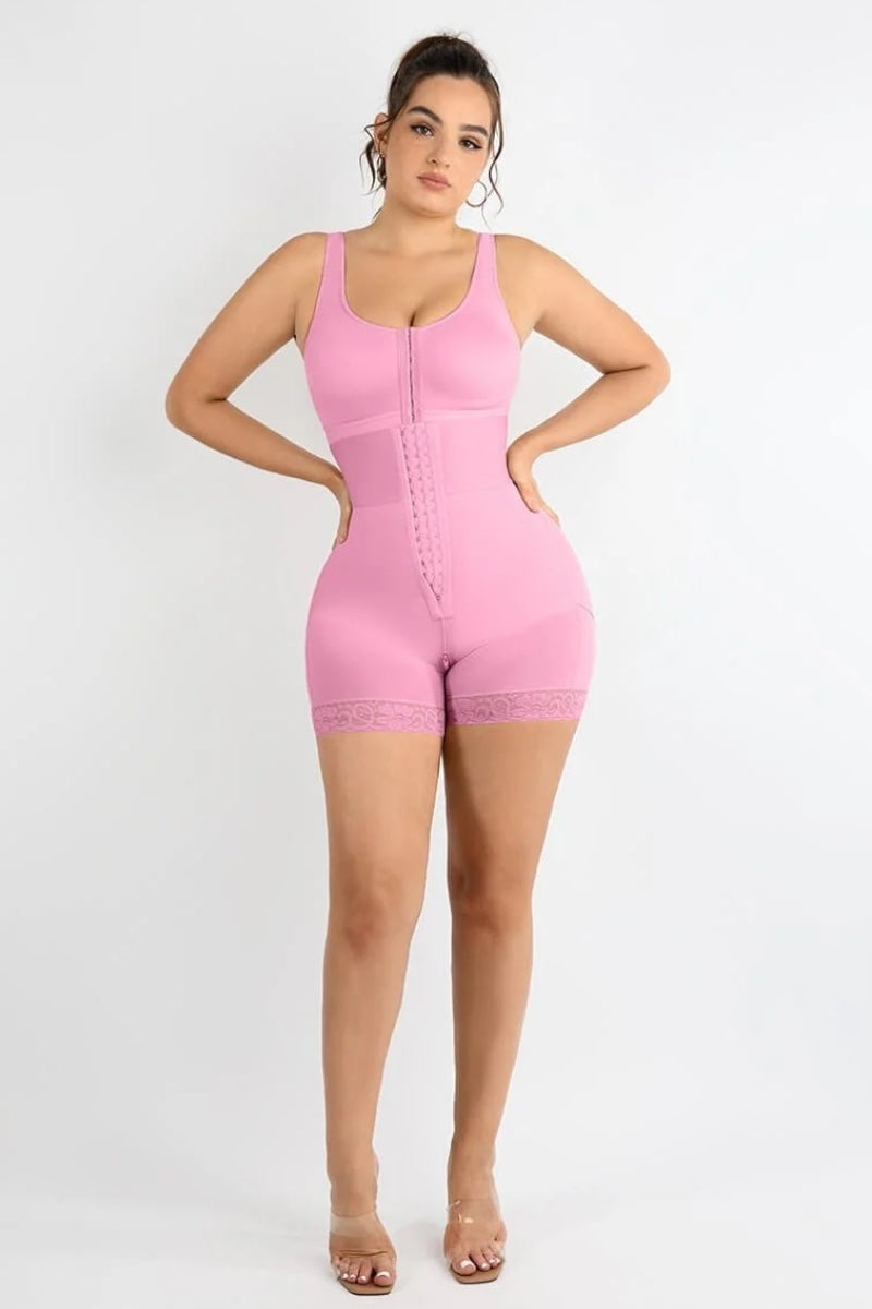 Woman wearing a pink shaper on a white background