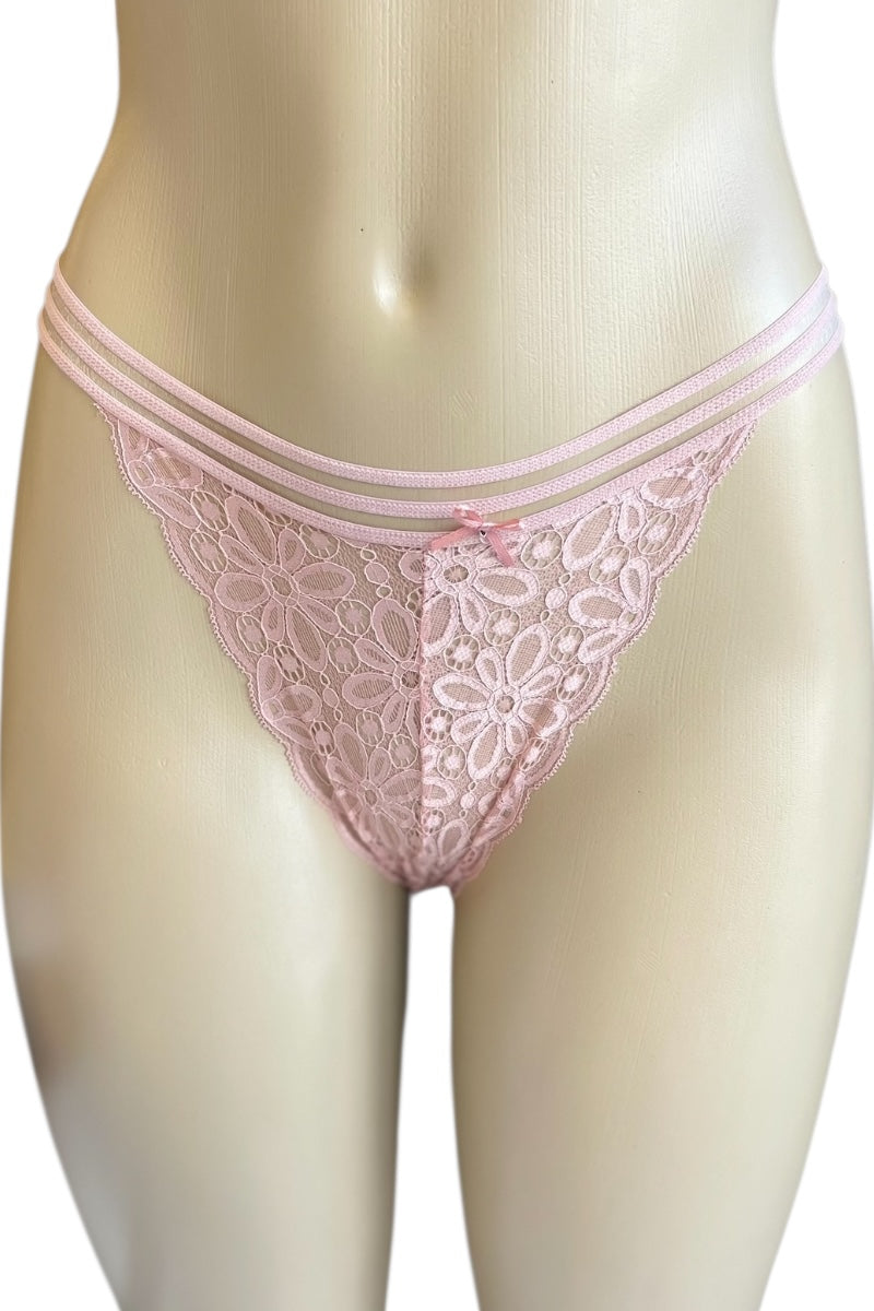 Pink lace thong on a mannequin against a white background