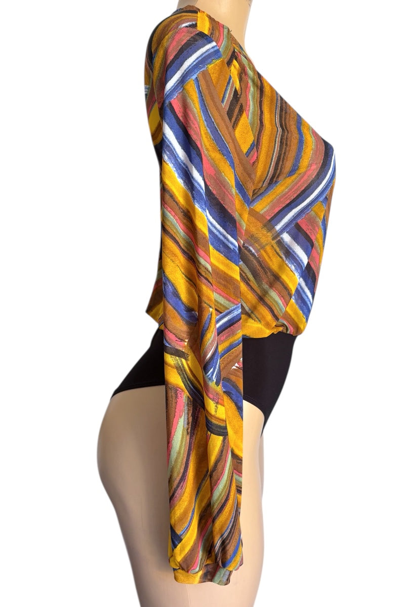 Colorful patterned shirt draped over a mannequin on a white background
