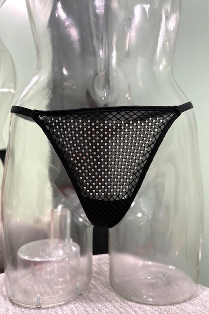 Black mesh thong with a dense cover of small silver rhinestones, displayed on a clear plastic female mannequin torso.