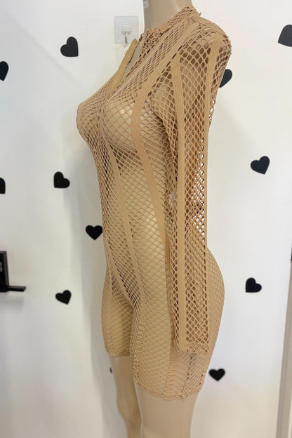 A beige fishnet mesh long-sleeve bodysuit displayed on a mannequin torso against a white wall with black heart decals.