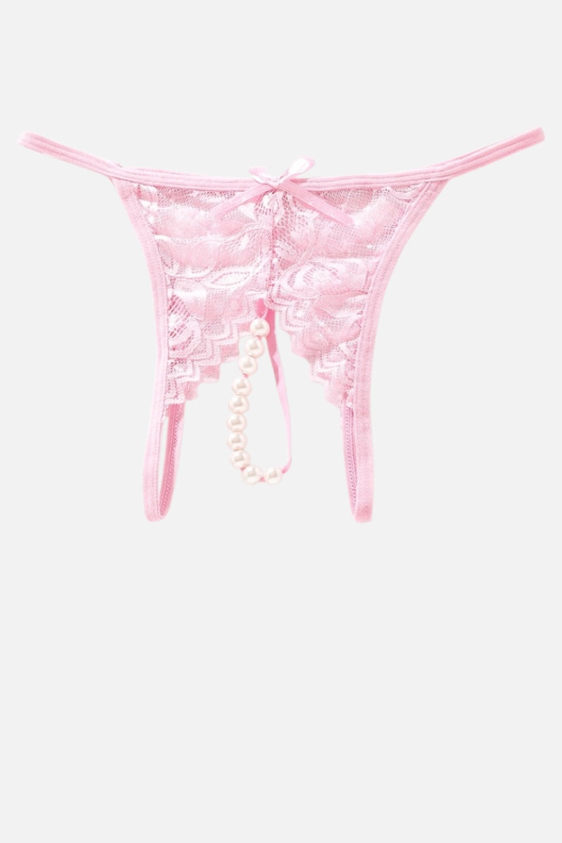 Light pink lace thong with a pearl bead chain and a small bow at the front, displayed against a light gray background.