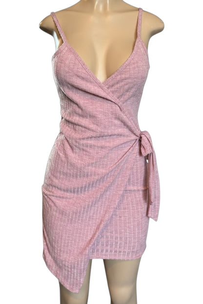 Pink ribbed dress on a mannequin against a white background
