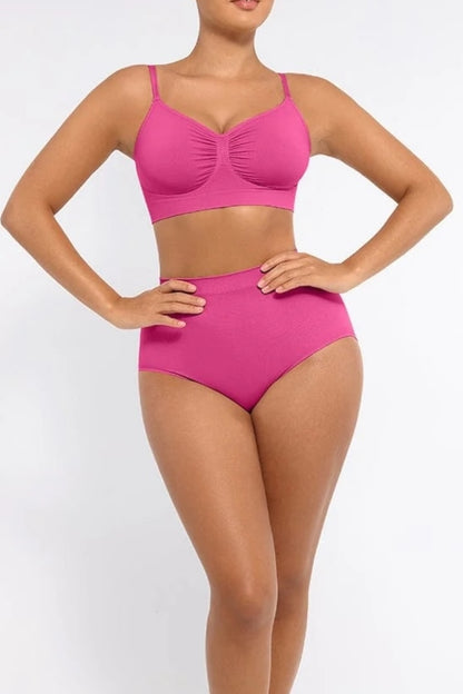 Person wearing a pink set on a white background