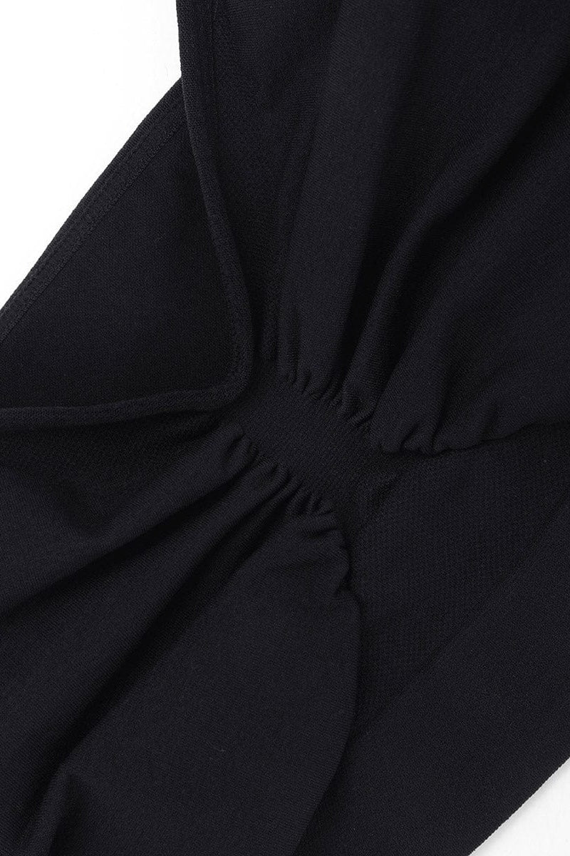 Close-up of a black bralette on a white background