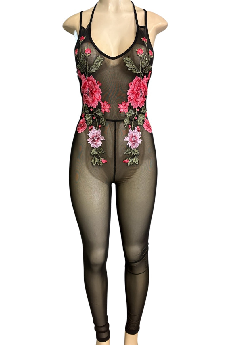 A sheer black bodysuit with pink and red floral embroidery and green leaves, displayed on a mannequin against a white background.