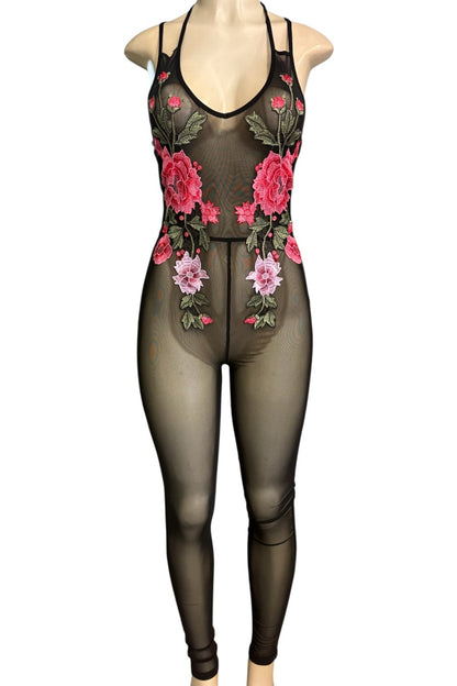 A sheer black bodysuit with pink and red floral embroidery and green leaves, displayed on a mannequin against a white background.