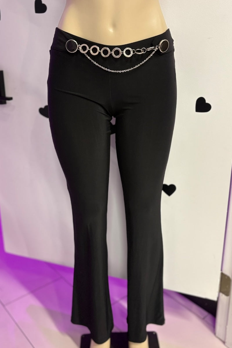 Black pants with a chain belt on a mannequin against a white background