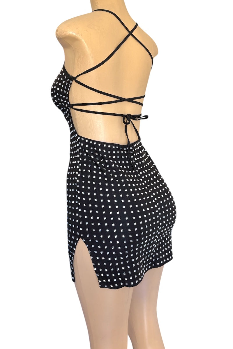 Black rhinestone dress with criss-cross straps on a mannequin against a white background
