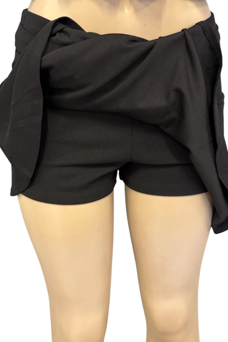 Black wrap-style shorts with a draped tie-front detail, shown on a mannequin against a plain white background.