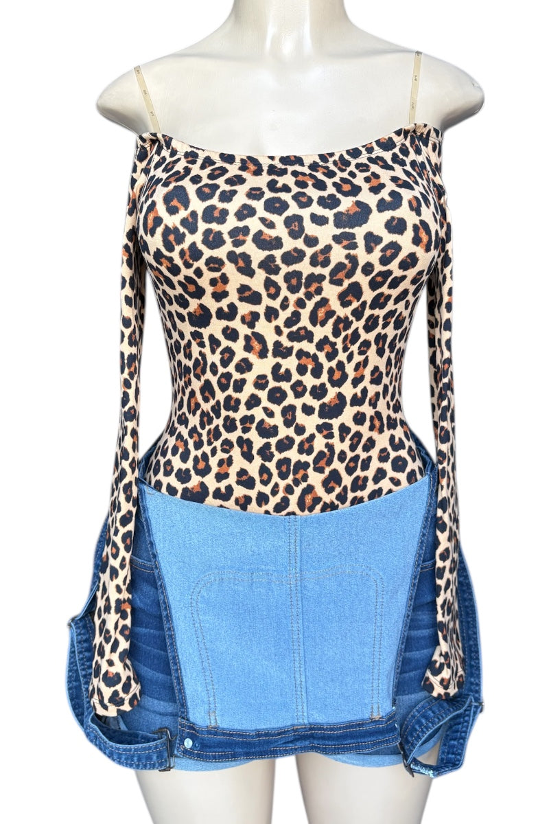Leopard print top with denim overalls on a mannequin against a white background