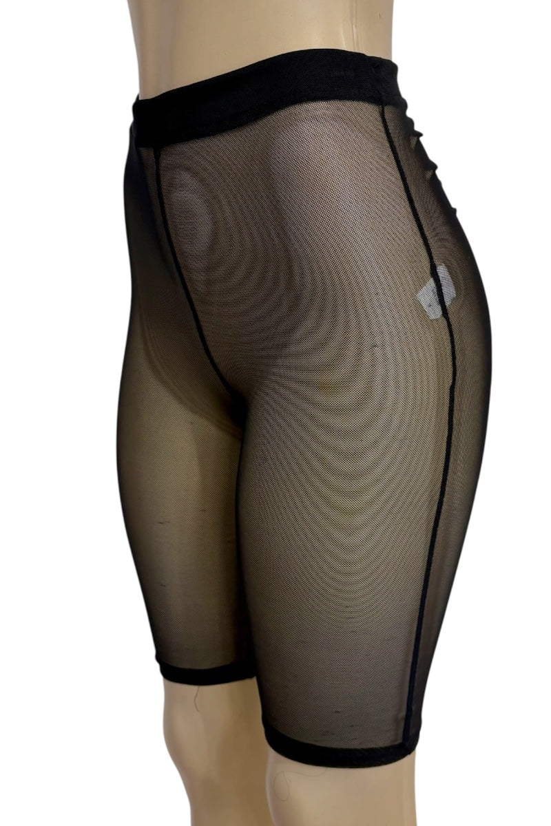 Black sheer mesh shorts with black trim, shown on a mannequin from a side/back angle against a white background.