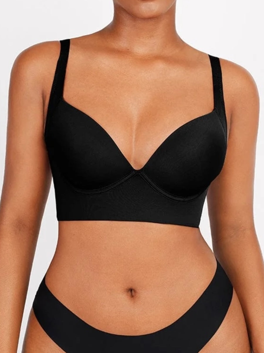 Black bra and panties set on a plain background