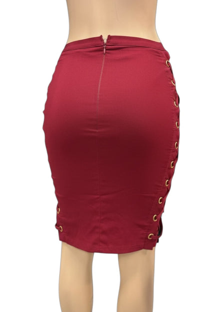 wine pencil skirt with gold ring details on a white background