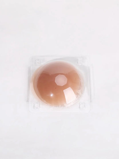 Brown nipple covers in packaging on a white background