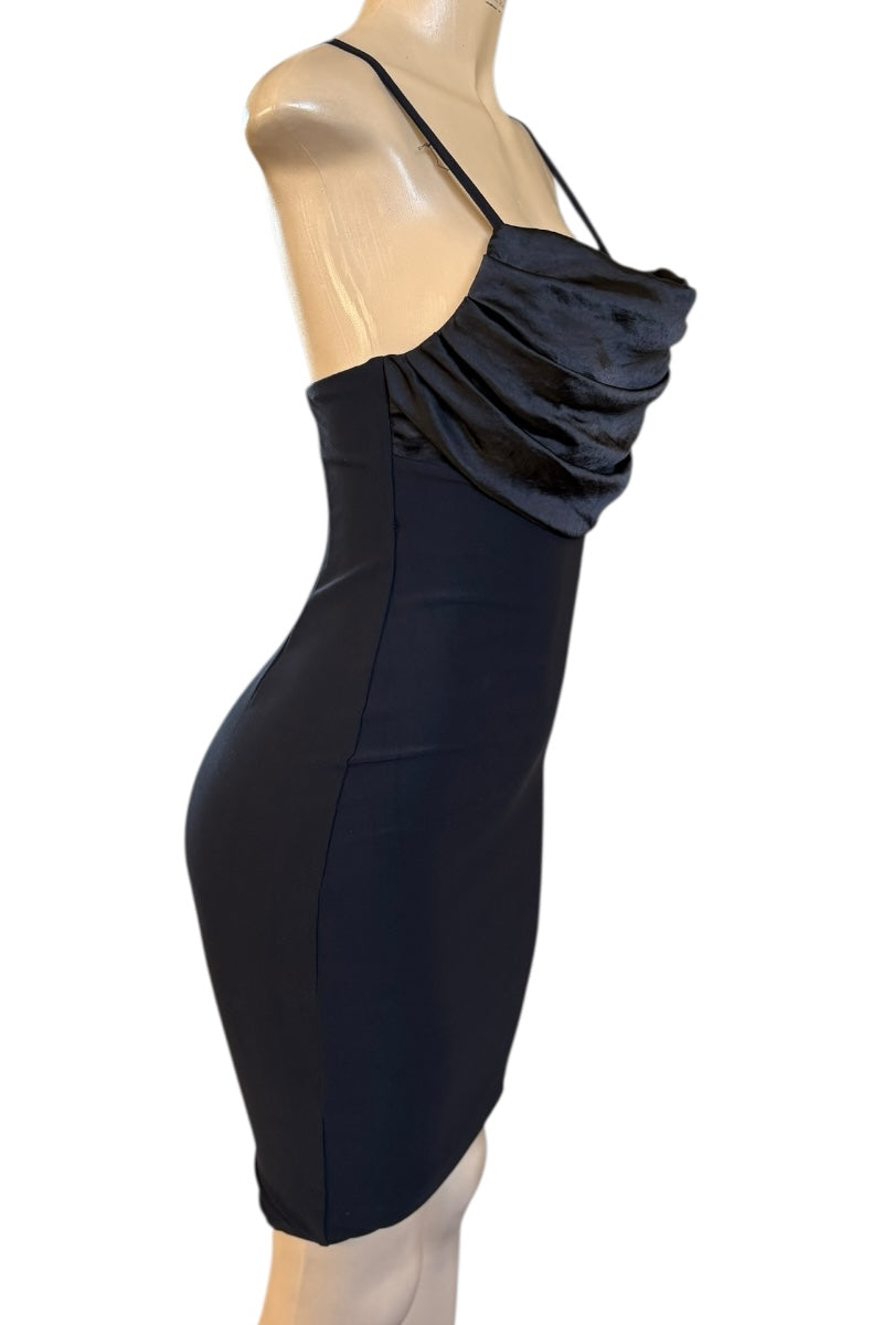 Black dress on a mannequin against a white background
