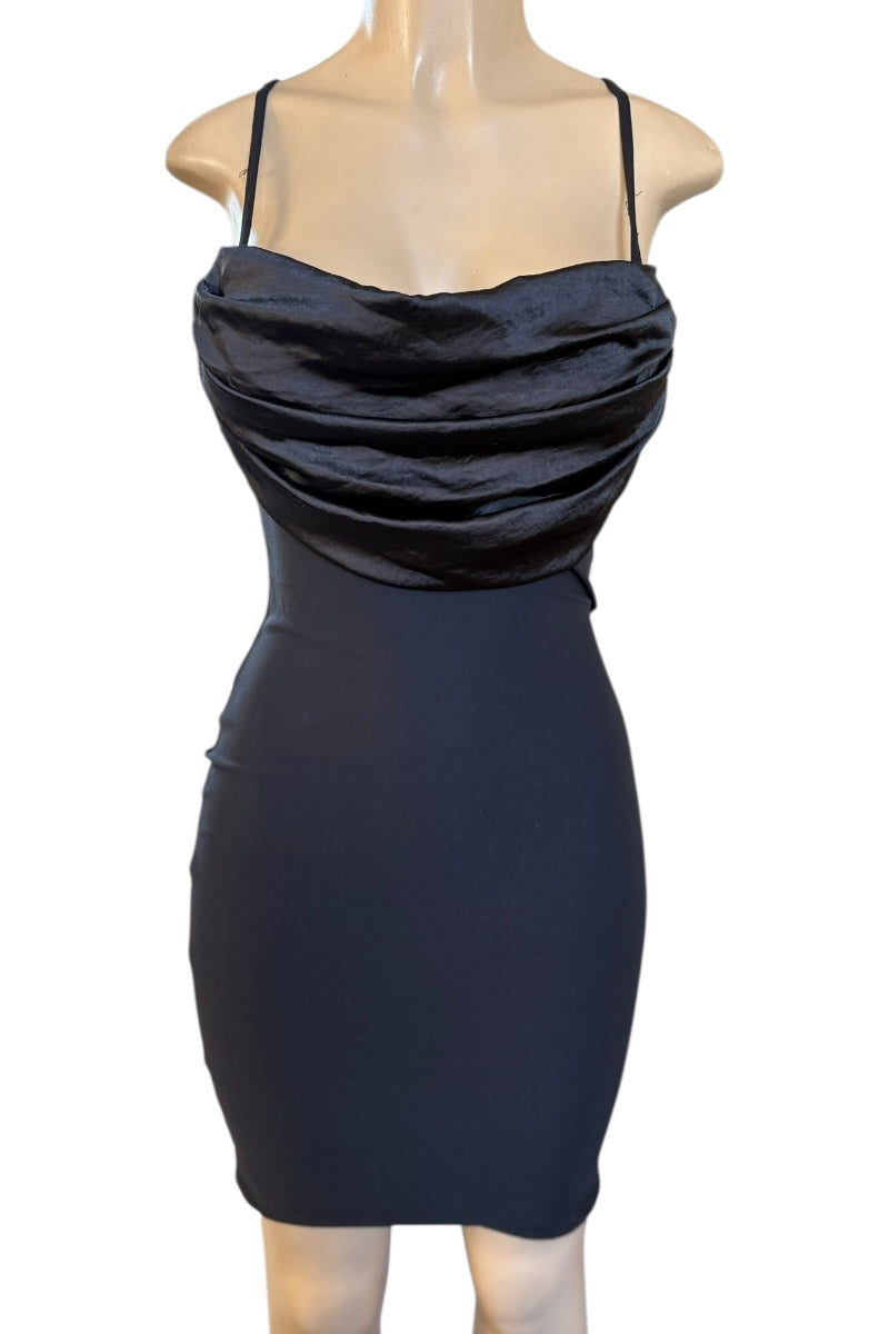 Black dress on a mannequin against a white background