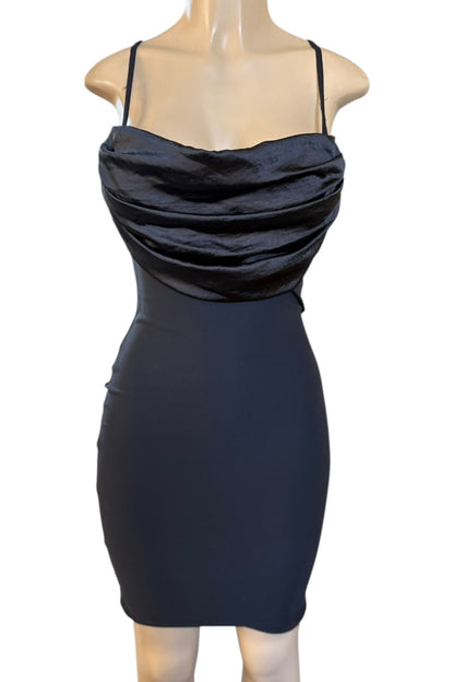 Black dress on a mannequin against a white background