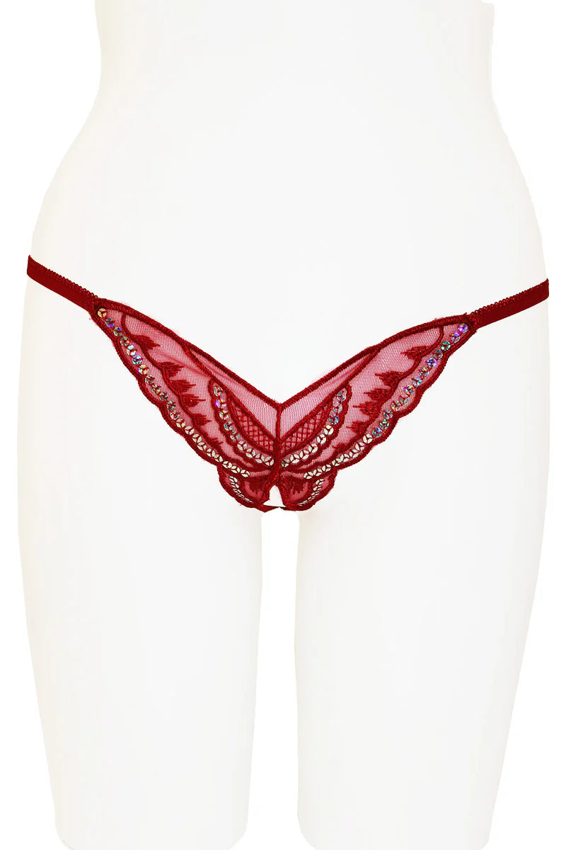 Red lace thong on a white mannequin against a white background