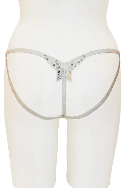 White thong with embellishments on a white background