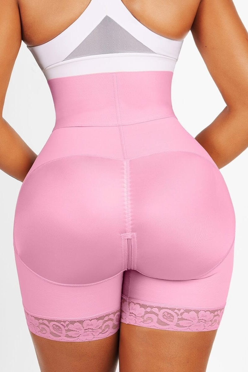 Pink shapewear with lace details on a plain background