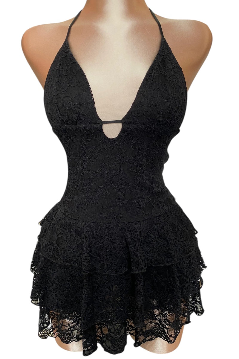 Black lace dress on a mannequin against a white background