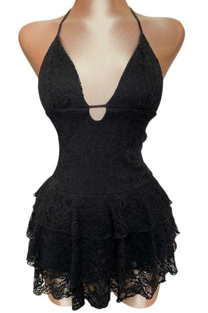 Black lace dress on a mannequin against a white background