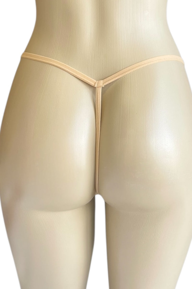 Beige thong on a mannequin against a white background