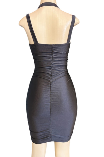 Black dress on a mannequin against a white background