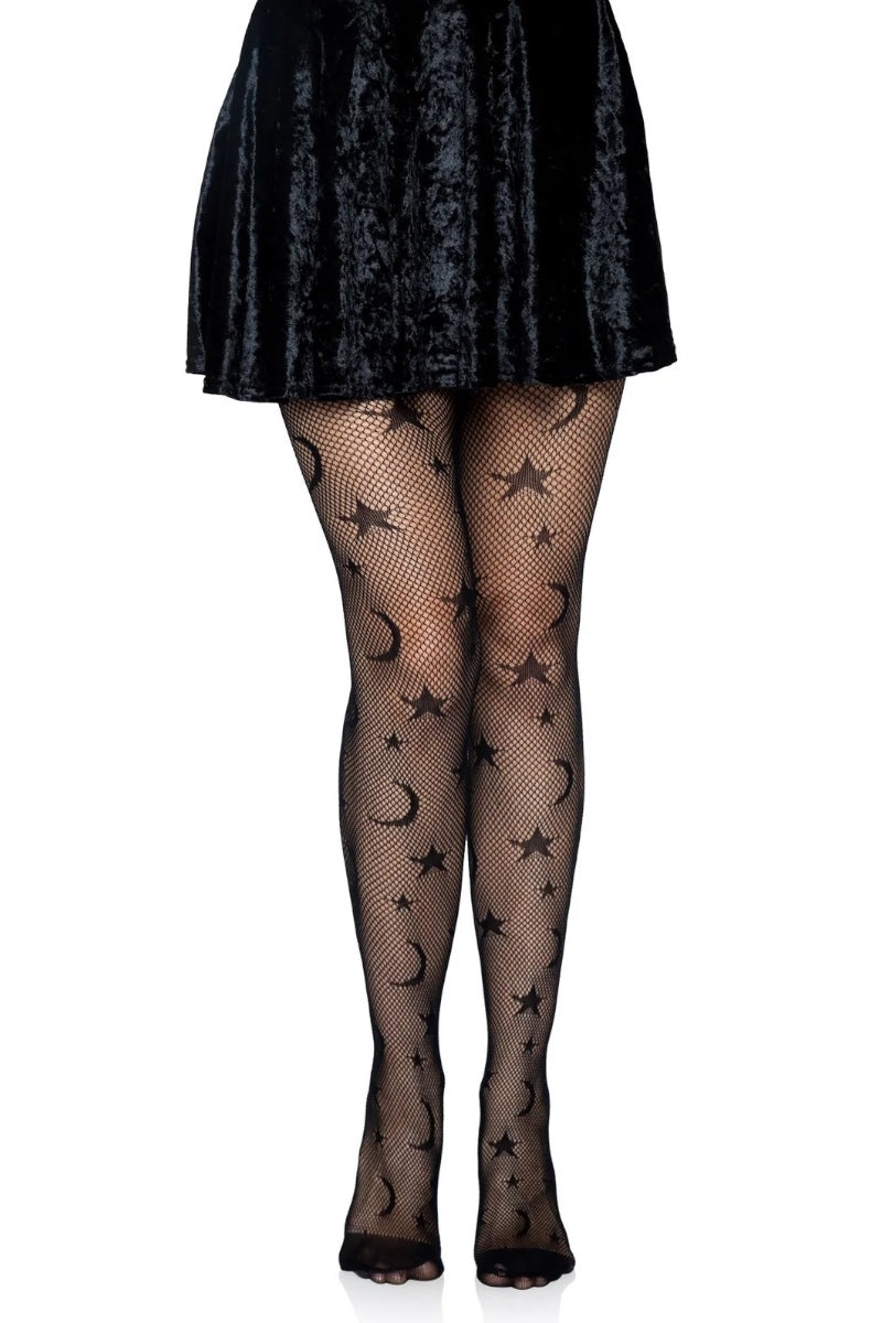 Black fishnet tights with a repeating pattern of black stars and crescent moons, shown on a model's legs wearing a black skirt.