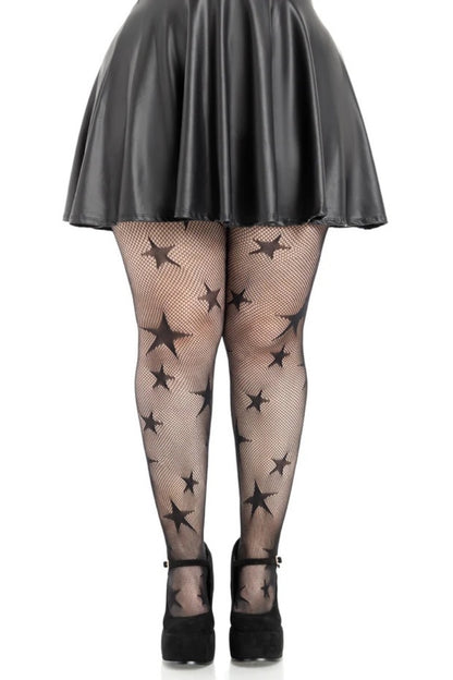 Black star-patterned fishnet tights worn by a model, paired with a black faux-leather mini skirt and black platform Mary Jane heels, shown from the waist down on a white background.