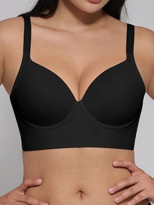 Black bra worn by a model against a neutral background