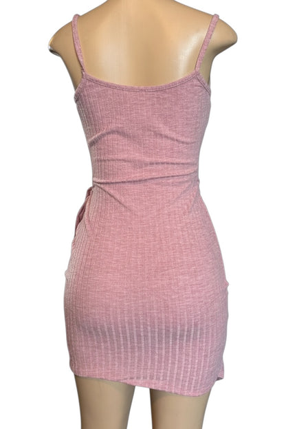 Pink dress on a mannequin against a white background