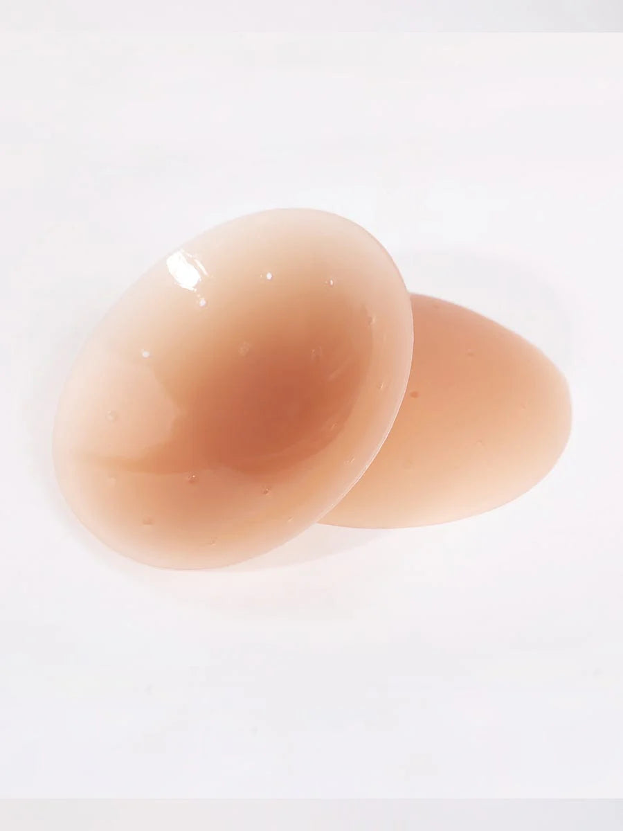 Two tan silicone cups on a white background