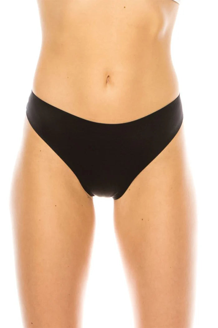 Black thong worn by a person on a white background