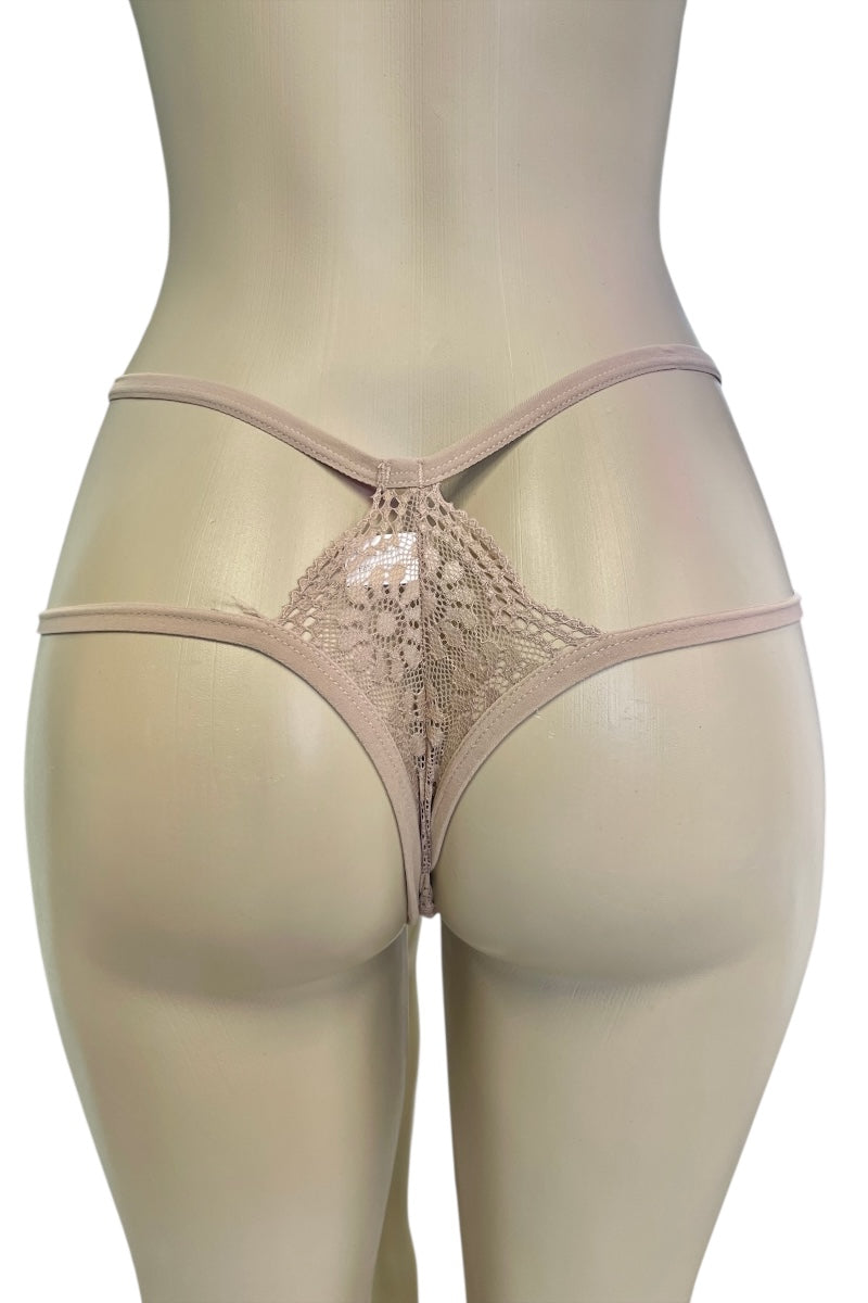 Beige lace thong on a mannequin against a white background