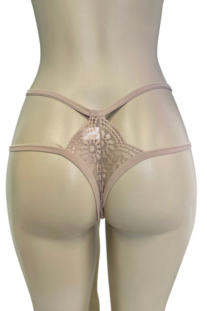 Beige lace thong on a mannequin against a white background