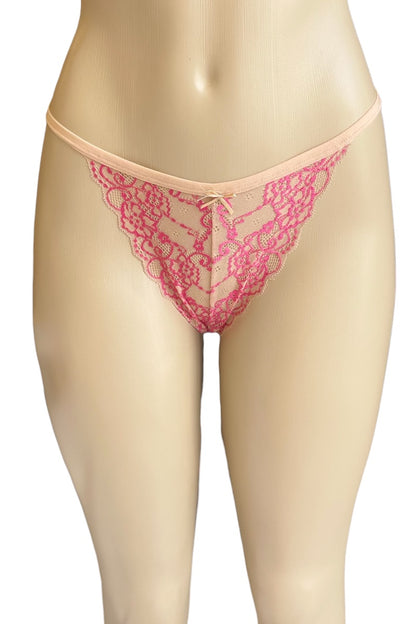 Pink lace thong on a beige mannequin against a white background