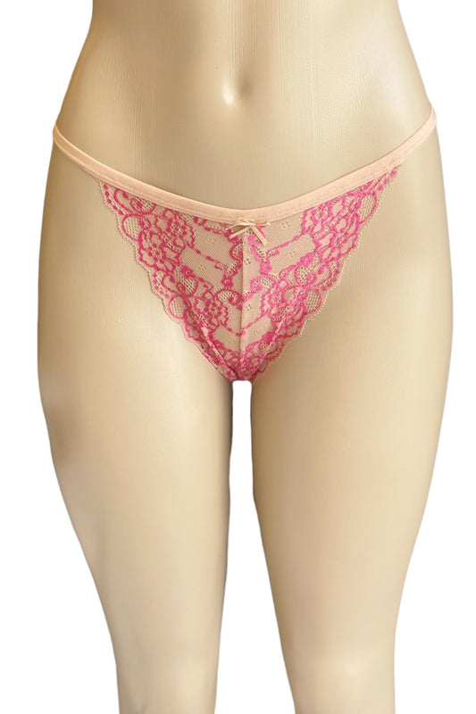 Pink lace thong on a beige mannequin against a white background