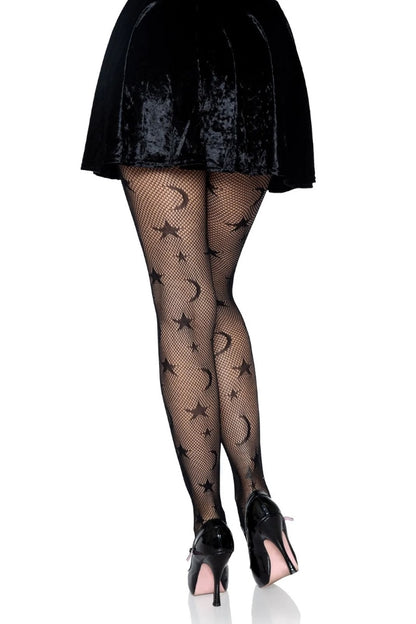 Black fishnet tights with a star and crescent moon pattern, worn by a model with a black skirt and black heels, shown from the waist down on a white background.