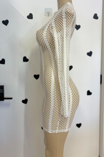 A white fishnet mesh long-sleeve mini romper displayed on a beige mannequin torso against a white wall with black heart decals.