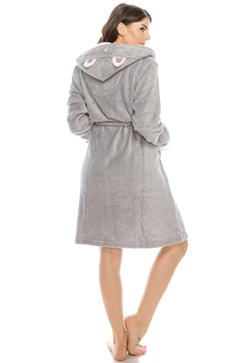 Woman wearing a gray hooded robe on a white background